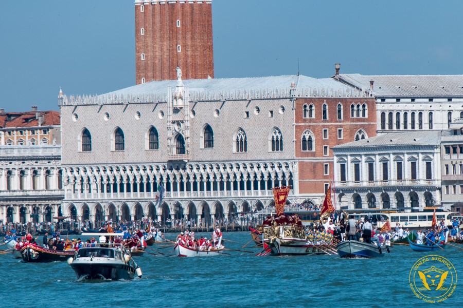 Festa della Sensa in Venice, Italy. The traditional rowing boats parade starting from the Basin of Saint Marco with the Mayor on top of the Barca Reale, the Royal Barge. Traditionally it would have been the Doge on the Bucintoro boat.