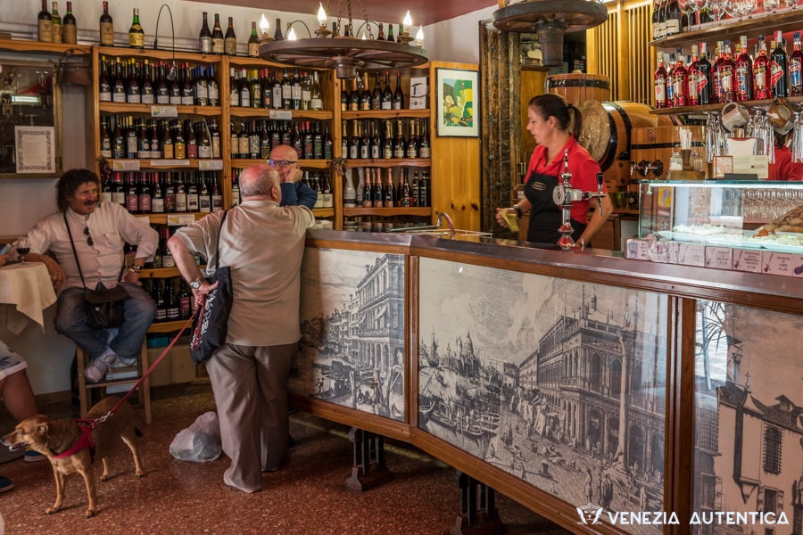 Inside view of the bacaro Cantina Aziende Agricole di Roberto Berti. Venetians stop here for cichetti in company or alone for a quick refill and a glass of wine.