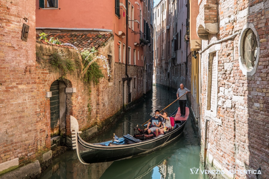 Couple doing a gondola ride in Venice, Italy