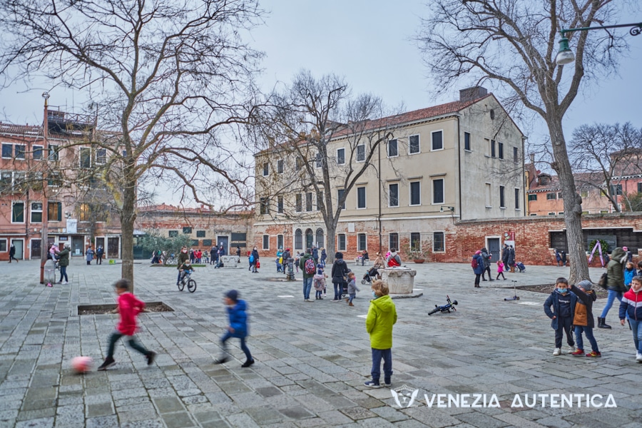 Children playing and running around the Jewish Ghetto of Venice on a winter afternoon
